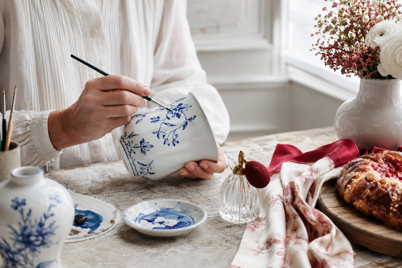 French artisan painting porcelain